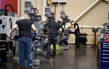 students using machines in a studio class